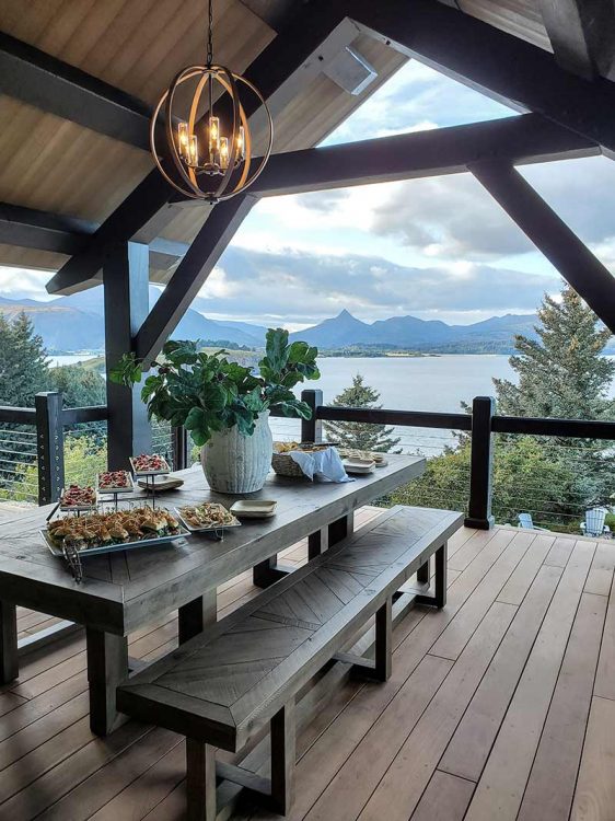 Doug fir porch overlooking the ocean and mountains in the distance