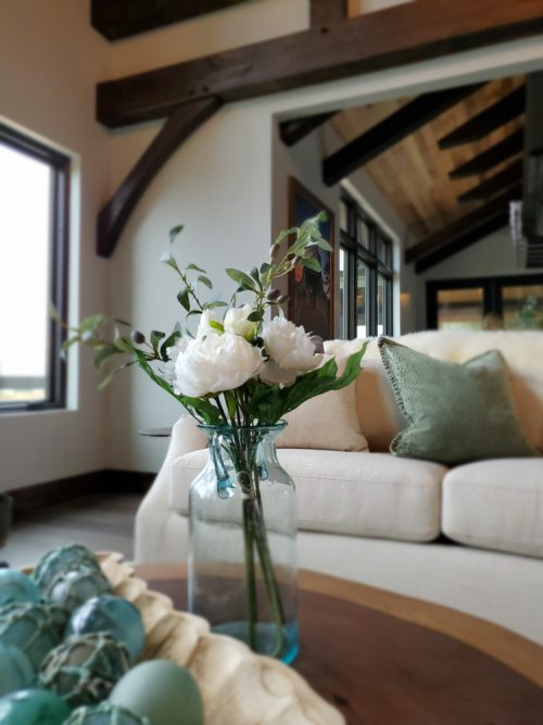 Flowers sitting on a coffee table in a great room