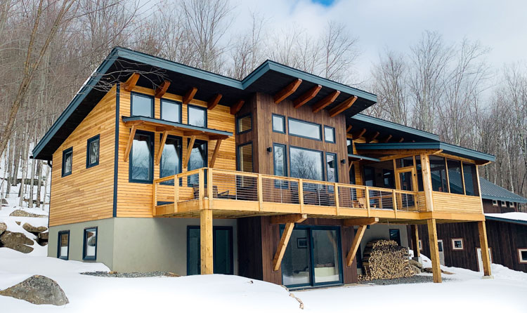 https://www.timberbuilt.com/wp-content/uploads/2020/07/featured-timber-frame-home-lake-placid-ny.jpg