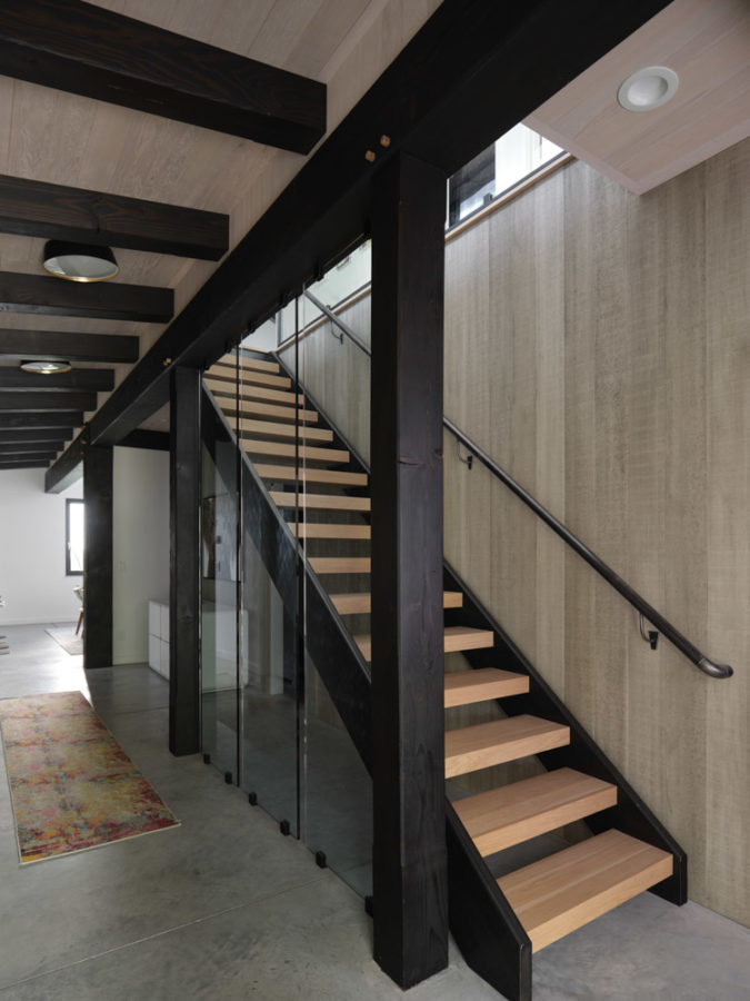 Beefy staircase with slab hardwood steps and tubular steel stringers